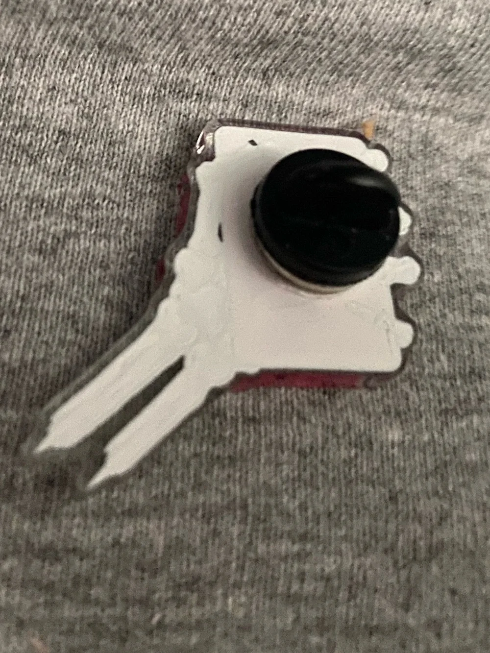 Plant Club collectible Pin featuring a skeleton hand holding pink bar of soap